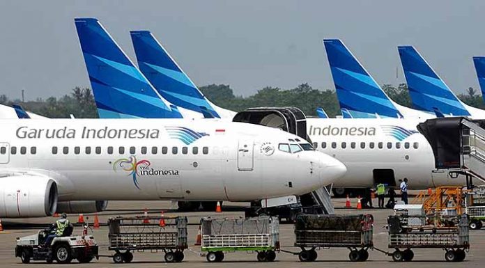 PT Garuda Indonesia meraup untung cukup signifikan. Dampak kian tingginya arus wisata.